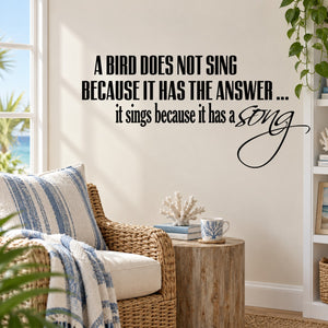 Wall quote decal with black bird quote text and cursive "song" design