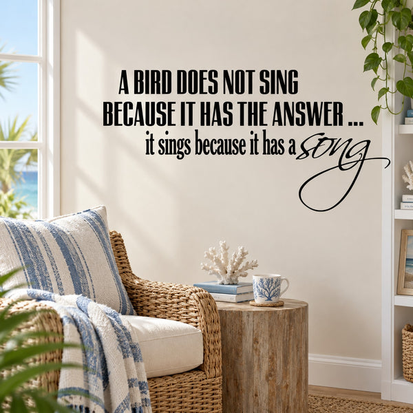 Wall quote decal with black bird quote text and cursive "song" design