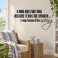 Wall quote decal with black bird quote text and cursive "song" design