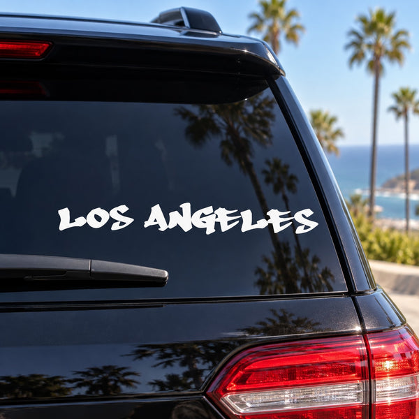 Los Angeles graffiti decal in white lettering on car rear window