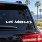 Los Angeles graffiti decal in white lettering on car rear window