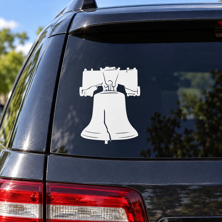 White Liberty bell decal with hanging clapper silhouette on car window