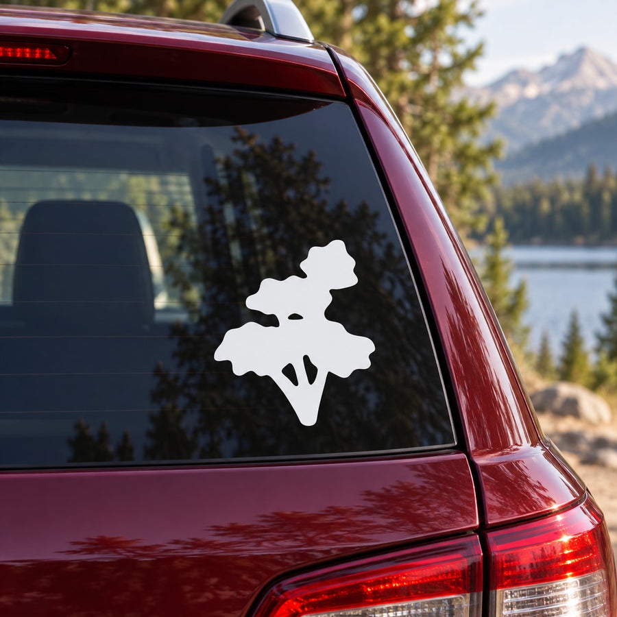 Landscape vinyl decal with mountain and tree silhouette on a car rear window