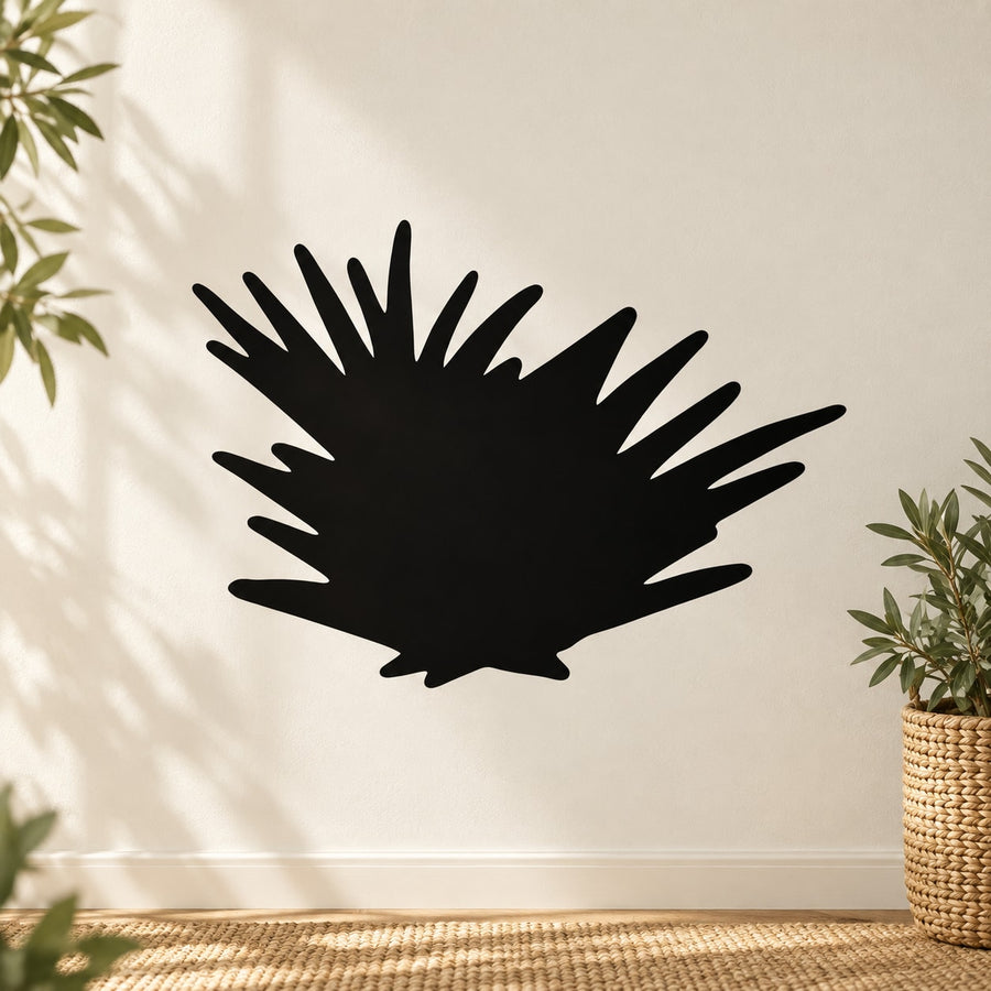 Black landscape vinyl wall decal with bold abstract sunburst silhouette