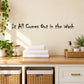 Wall decal with black quote text: “It All Comes Out in the Wash”