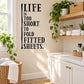 Wall decal with quote: LIFE IS TOO SHORT TO FOLD FITTED SHEETS.