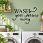 Wall decal lettering: 'WASH your worries away' in bold and script