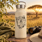 Leopard head decal with black-and-white spots on a light-colored bottle