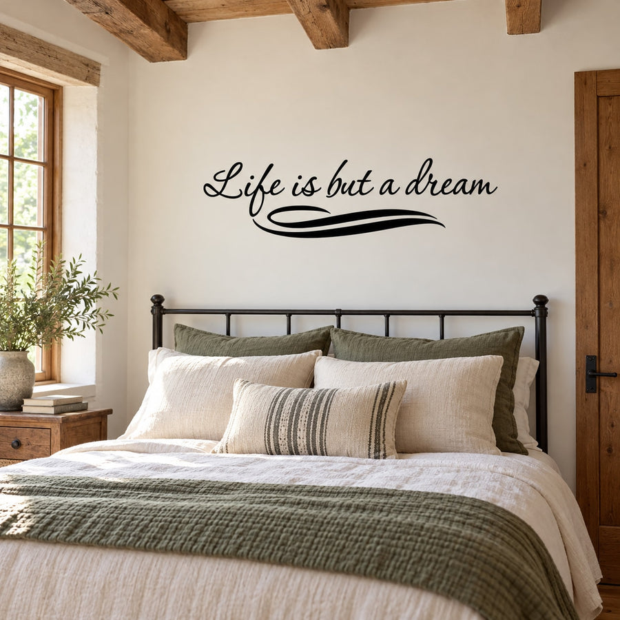Wall decal with cursive quote “Life is but a dream” in black script