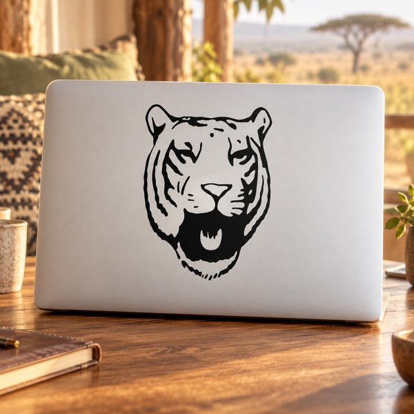 Black tiger head decal on white laptop lid