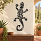 Black abstract lizard wall decal with ornate swirls and flower details
