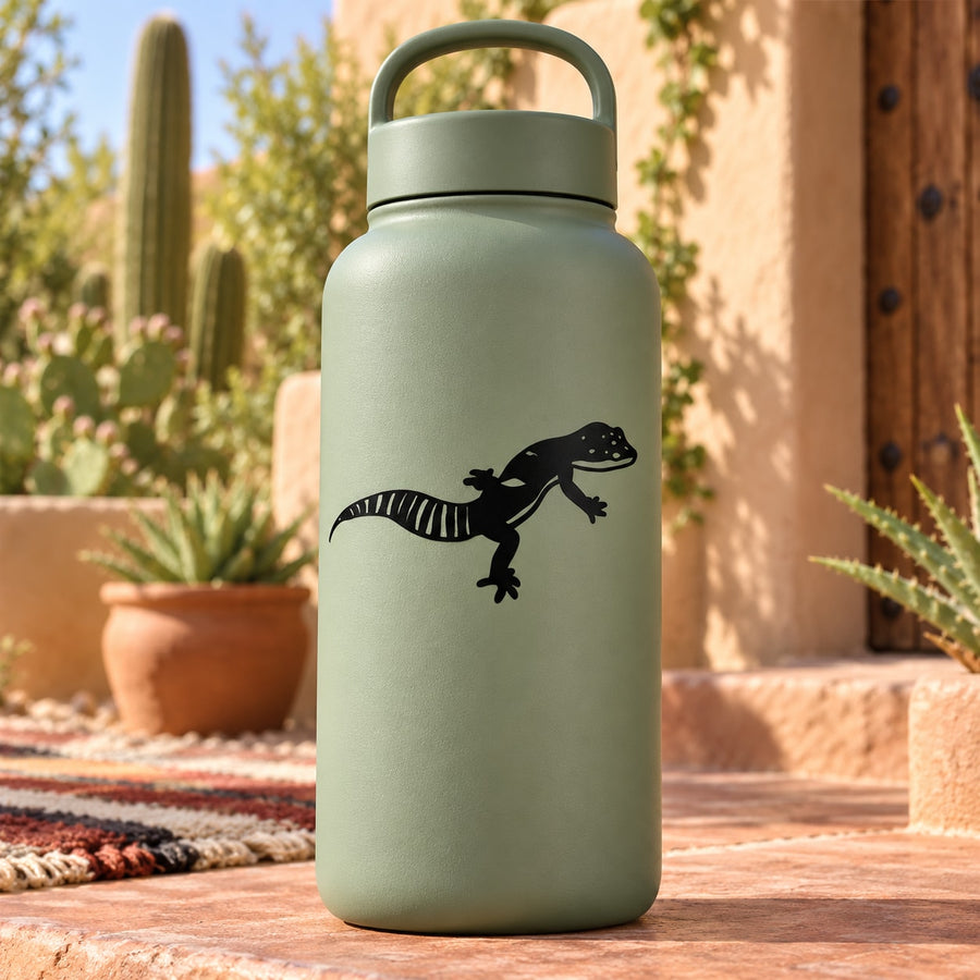 Black African fat-tailed gecko decal on light green bottle