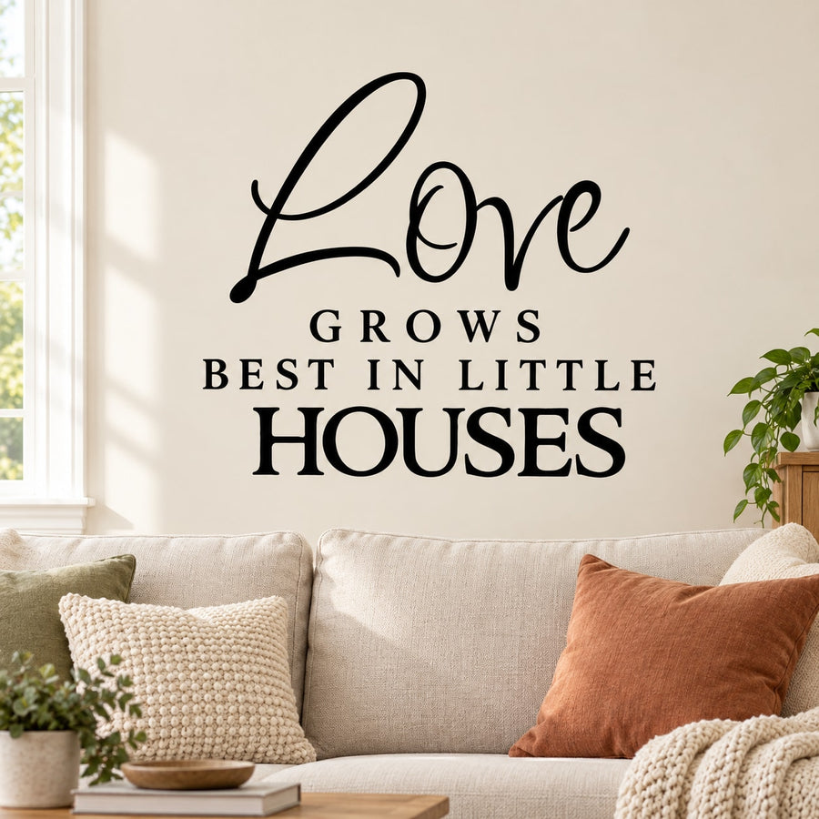 Black wall decal with 'Love grows best in little houses' lettering