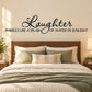 Laughter wall decal with decorative script and sparkles quote text