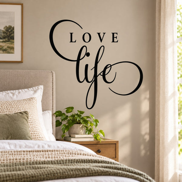 Black cursive wall decal with arched “Love” and flowing “life” lettering