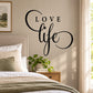 Black cursive wall decal with arched “Love” and flowing “life” lettering