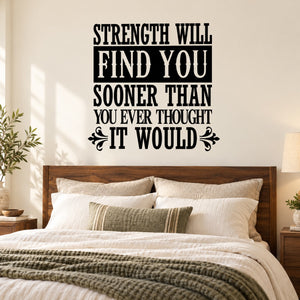 Wall decal with quote “STRENGTH WILL FIND YOU” in black lettering