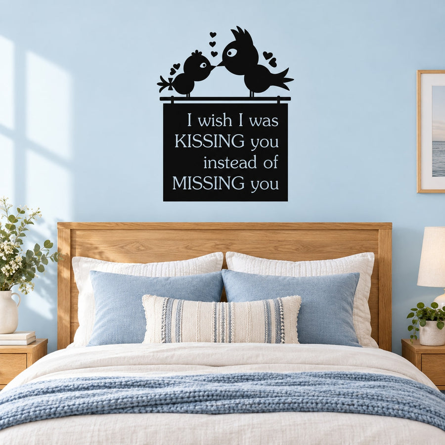 Black wall decal of two birds with hearts, quote: “kissing you instead of missing you”