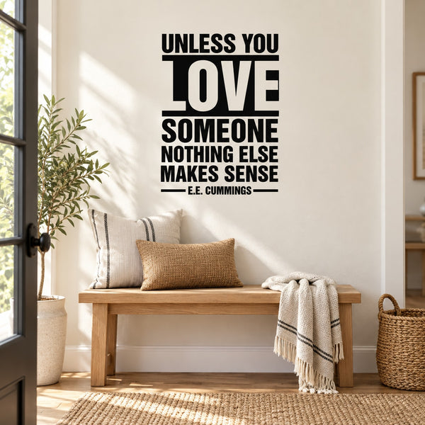 Wall quote decal with bold black lettering: Unless you love someone, nothing else makes sense.