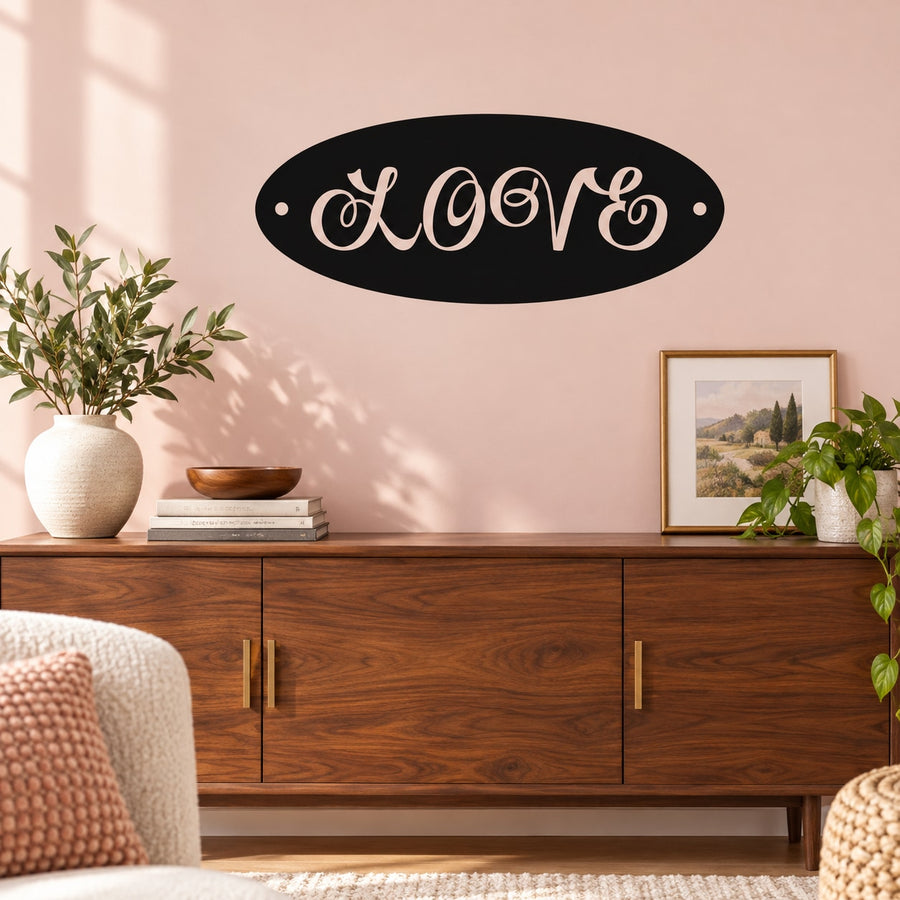 Black oval Love wall decal with white cursive lettering and small side dots