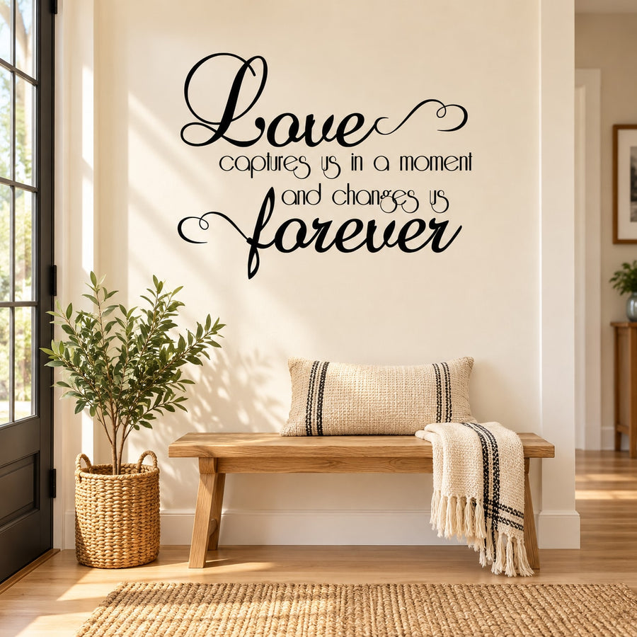 Wall decal with cursive quote: 'Love captures us in a moment and changes us forever'.