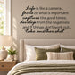 Wall decal with black cursive motivational quote text on a light wall