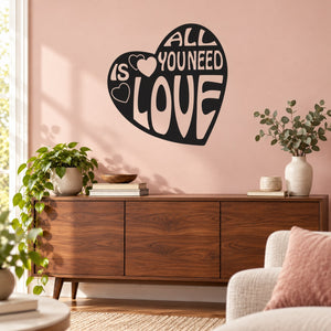 Black heart wall decal with "All you need is love" lettering
