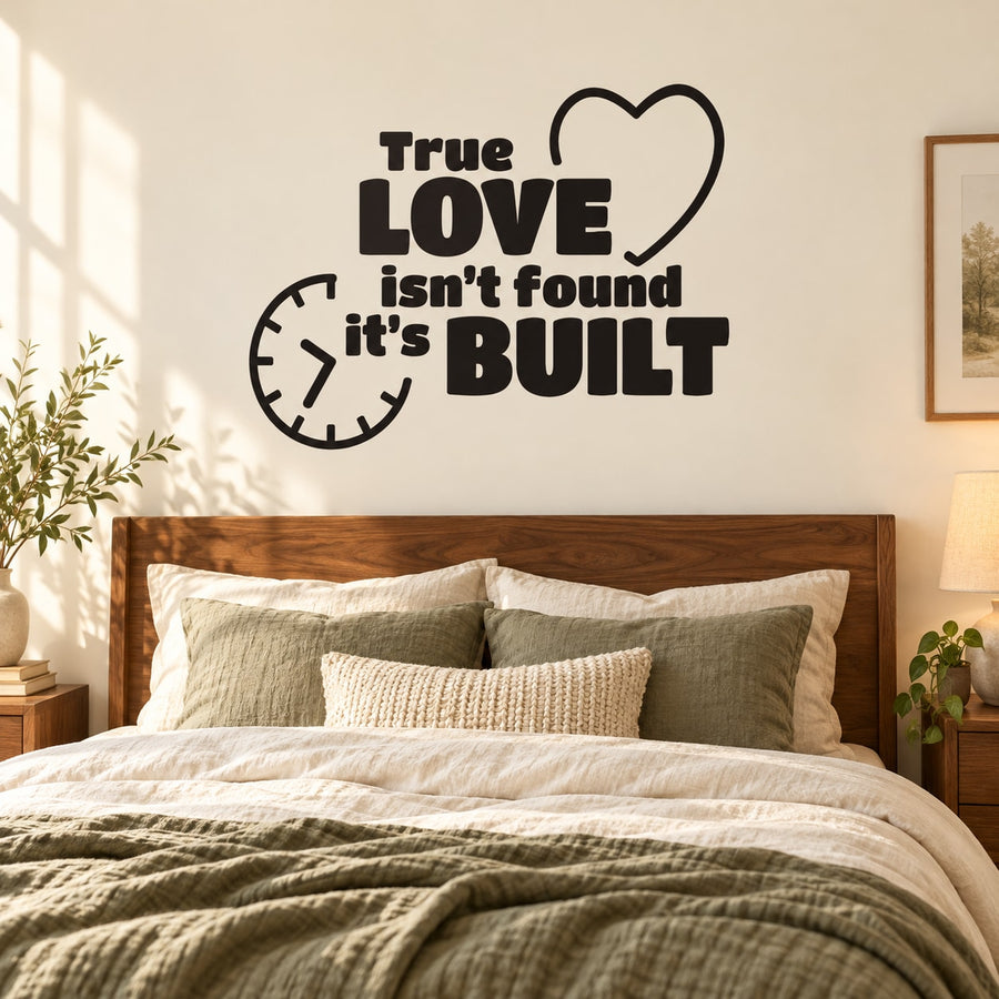 Wall quote decal with heart and clock, reading “True LOVE isn’t found, it’s BUILT”