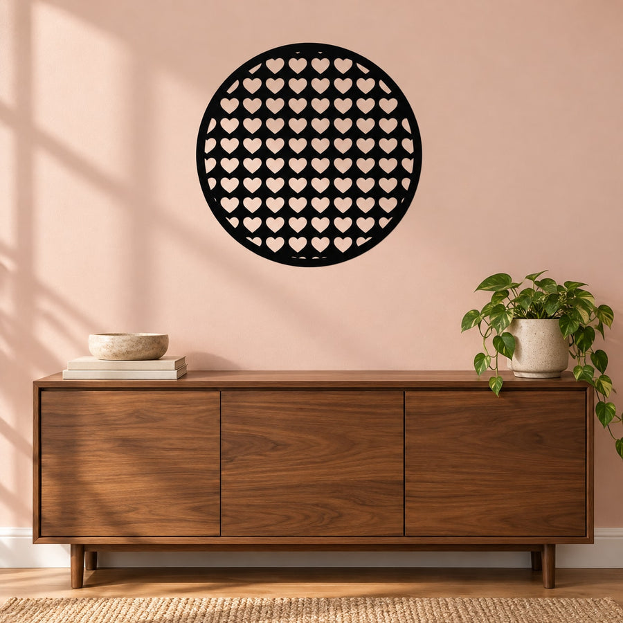 Round black wall decal with small heart pattern