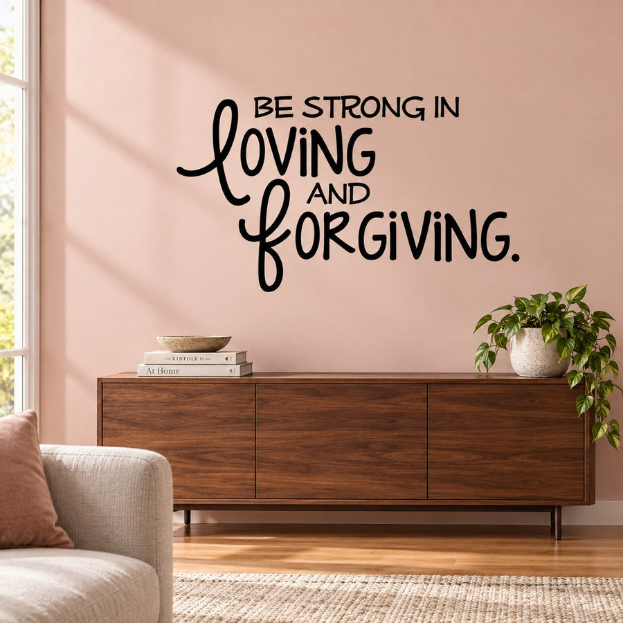 Inspirational wall decal with black text: “Be Strong In Loving And Forgiving.”