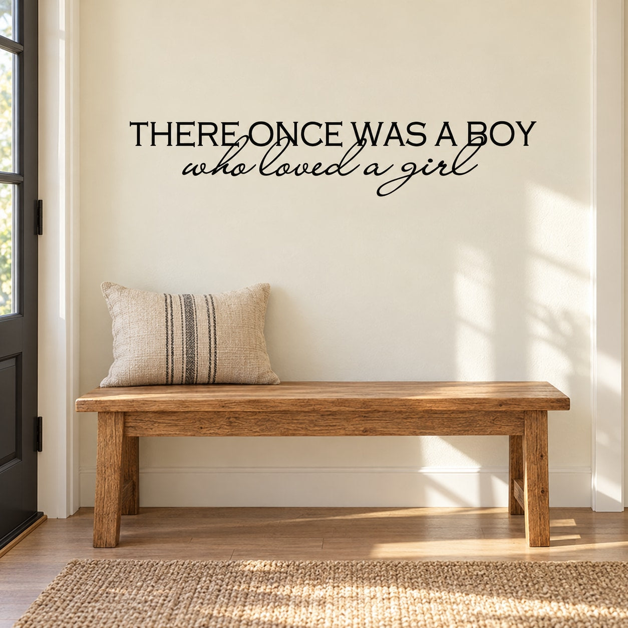 Wall decal text: “There once was a boy who loved a girl” in black lettering