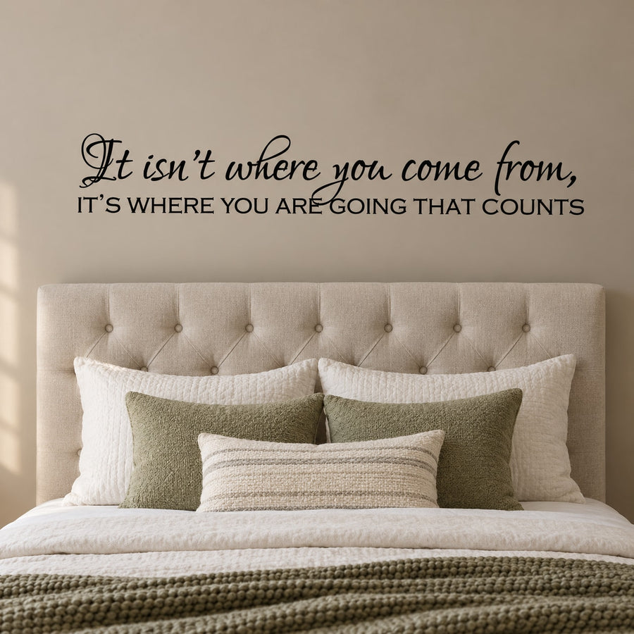 Wall quote decal with cursive and bold text: It isn’t where you come from, going that counts