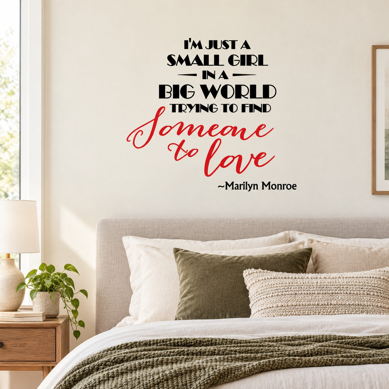 Wall decal with quote text in black and red script, including “Marilyn Monroe”