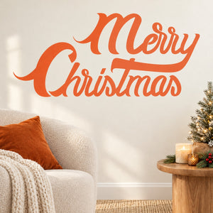 Ribbon-style Merry Christmas wall decal in orange cursive lettering