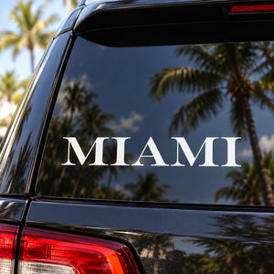 Car window text decal with white 'MIAMI' lettering