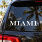 Car window text decal with white 'MIAMI' lettering