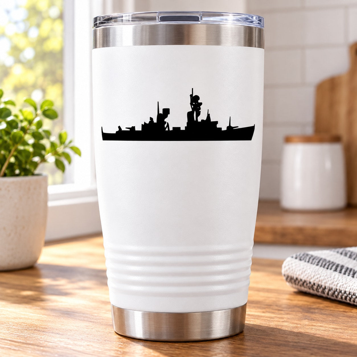 White tumbler with black ship silhouette decal