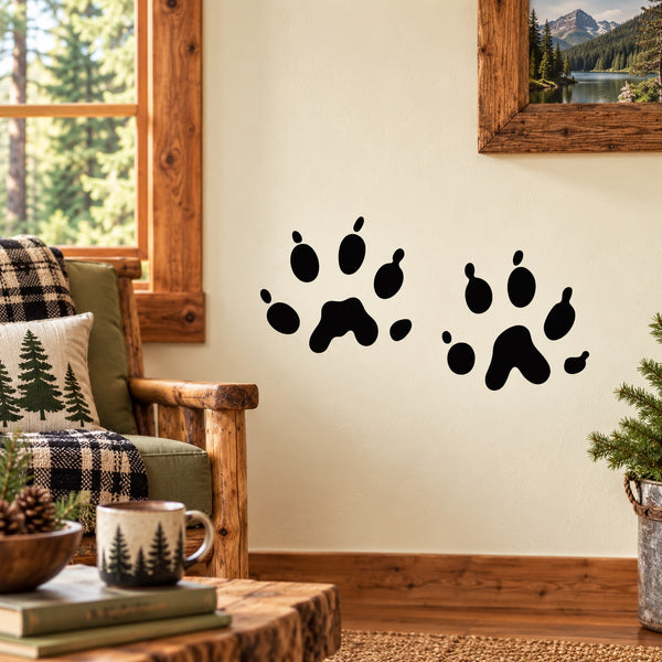 Black pet paw track decal with multiple paw prints on a light wall