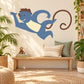 Smiling cartoon monkey wall sticker with blue body and curled tail