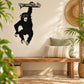 Hanging monkey wall decal in black, featuring a swinging monkey design
