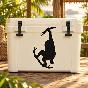 Monkey grabbing branch decal: black monkey silhouette on a light cooler