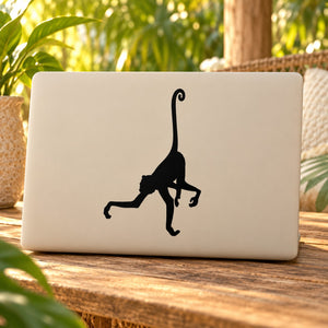 Long-tailed monkey decal, black silhouette on light surface