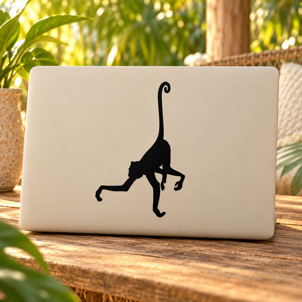 Long-tailed monkey decal, black silhouette on light surface