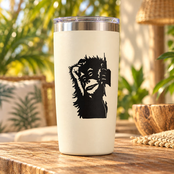 White tumbler with black shaggy hair monkey face decal on the front