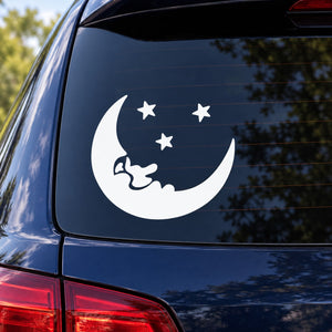 White moon and star decal sticker on a car window