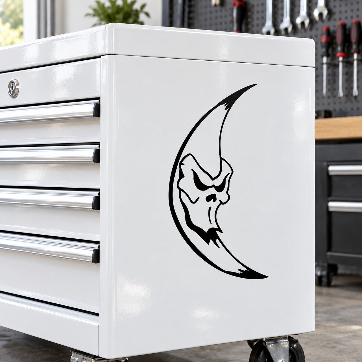 Frightful moon decal with black crescent-and-face design on white surface