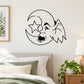 Black line-art gremlin face wall decal on crescent moon with star