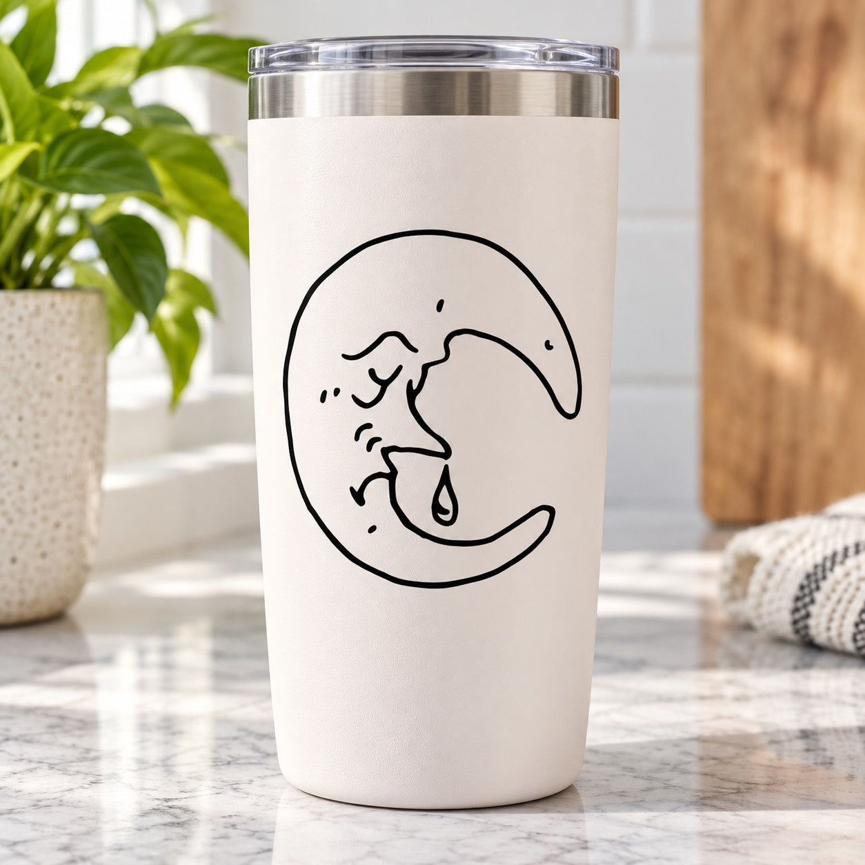 White tumbler with black crying moon decal, water-drop face and star details