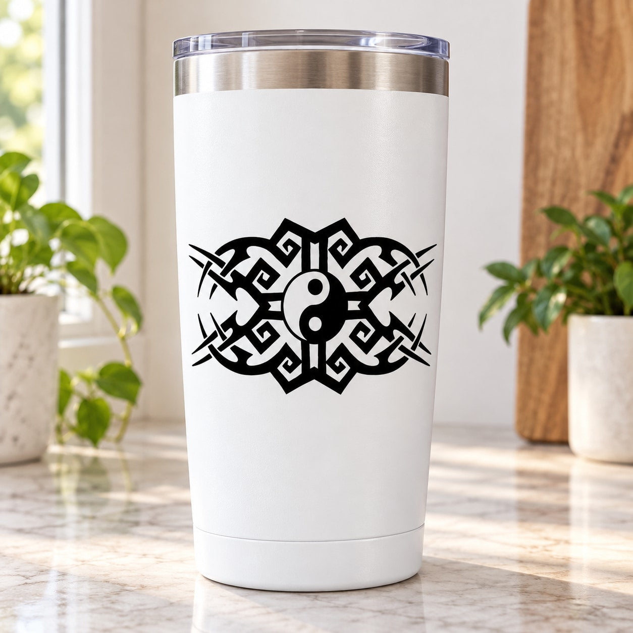 Yin yang moons vinyl decal with black geometric design on white tumbler