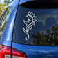 White outline moon flower decal with growing stem on car window